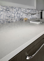 Rio Lago Alaska Gray — supplier room illustration; pebble surface shown with other materials (SMOT-PEB-ALGRY)