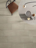 Metropolis 12x24 Matte Stained-Concrete-Look Porcelain Tile — installed room view — color Avorio