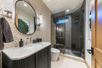 Rio Lago Natural-Stone Pebble Mosaic — installed room view — color Black