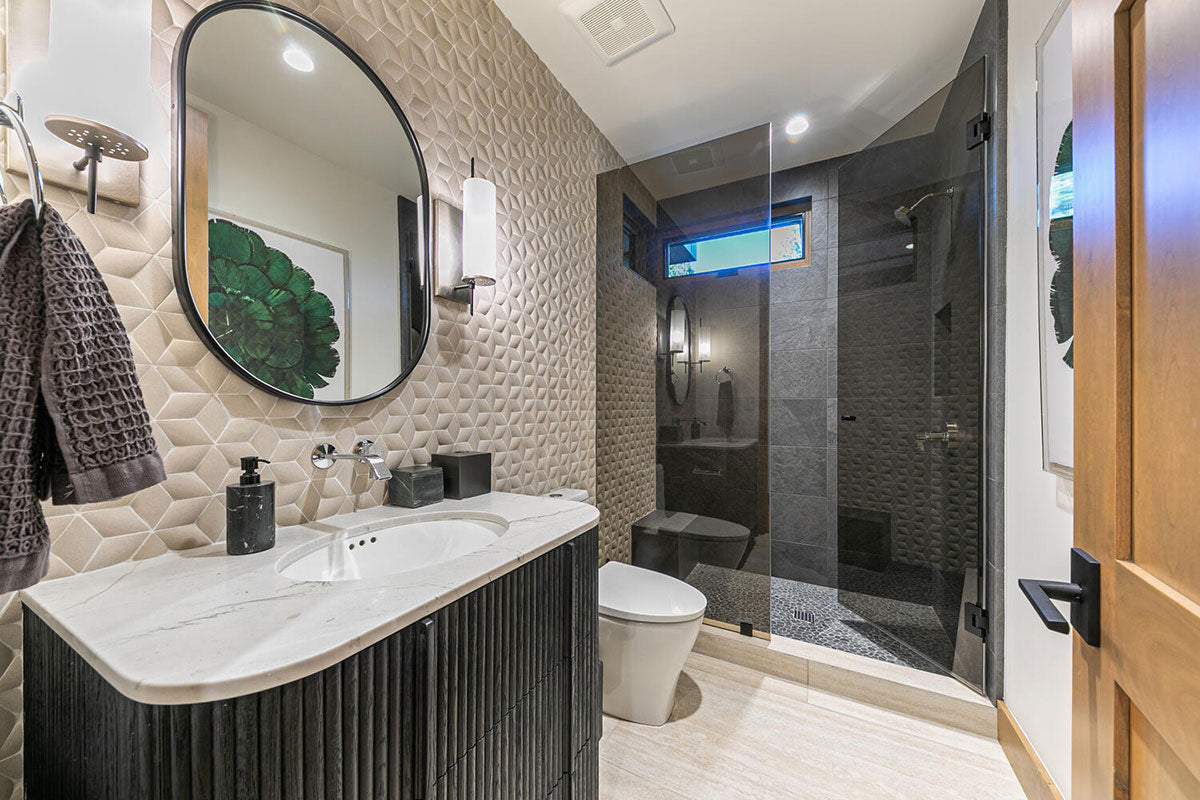 Rio Lago Natural-Stone Pebble Mosaic — installed room view — color Black