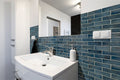 Blue Shimmer 2x6 Glass Subway Tile — installed room view — color Shimmer
