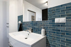 Blue Shimmer 2x6 Glass Subway Tile — installed room view — color Shimmer