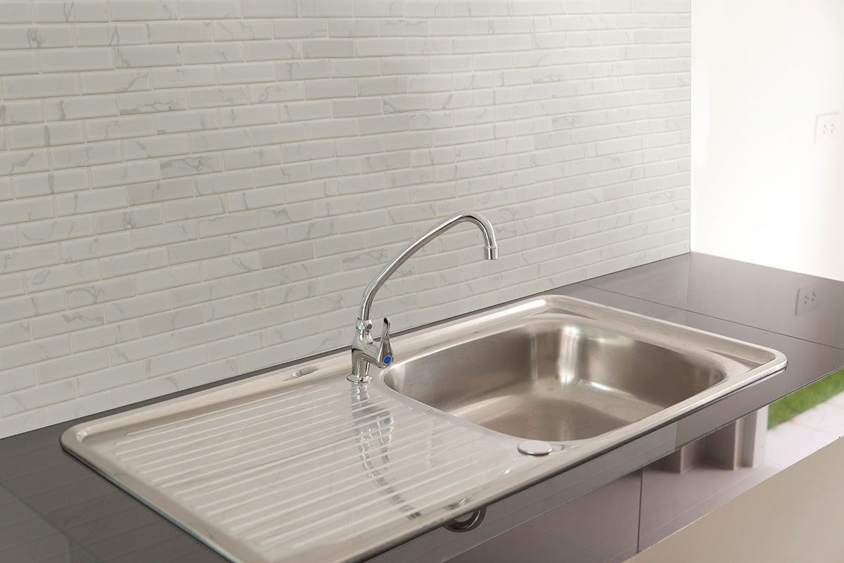 Carrara Matte 1x4x6mm Porcelain Mosaic — installed room view — color White-cool with subtle gray veining