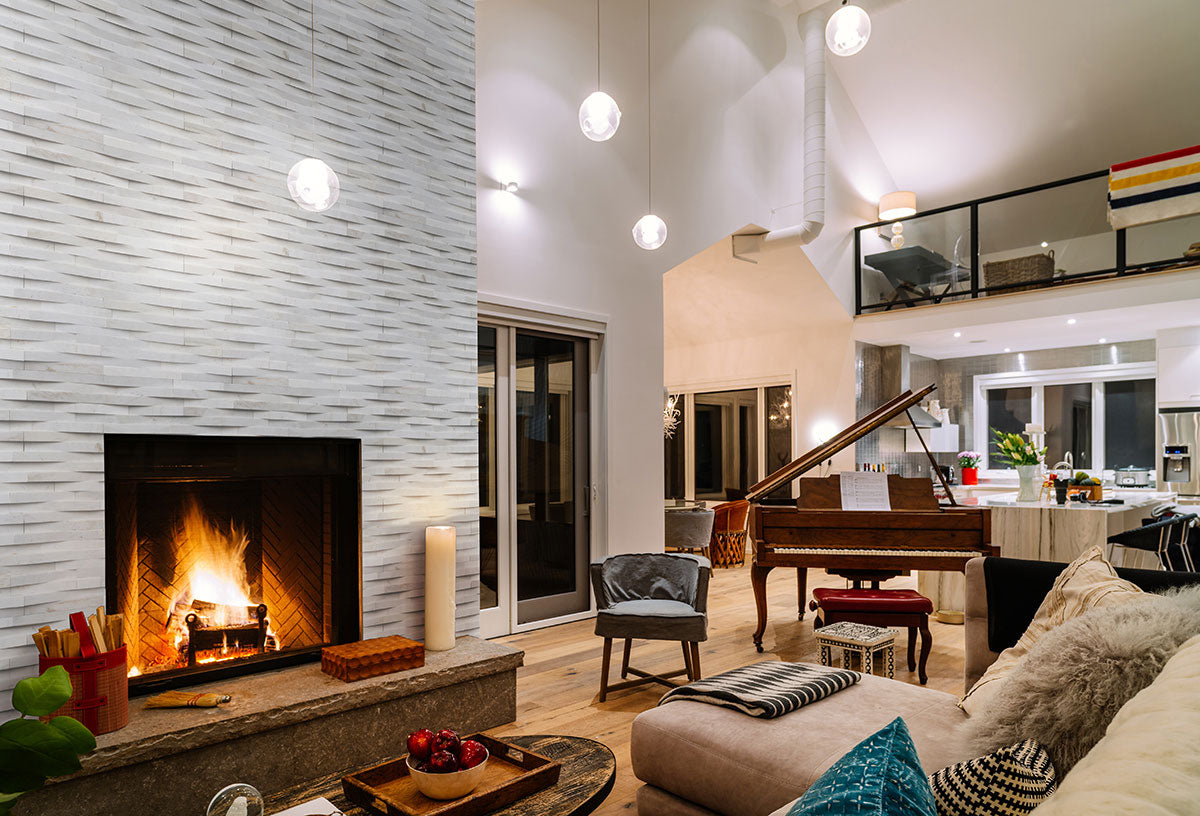 Rockmount 3D Natural-Stone Stacked Stone Panel — installed room view — color Cosmic White Wave Panel