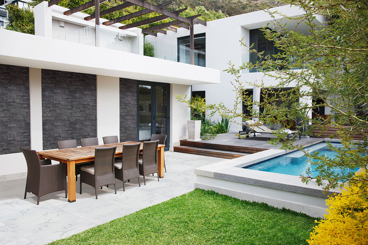 Praia 3x24 Porcelain Bullnose Trim — installed room view — color Carrara