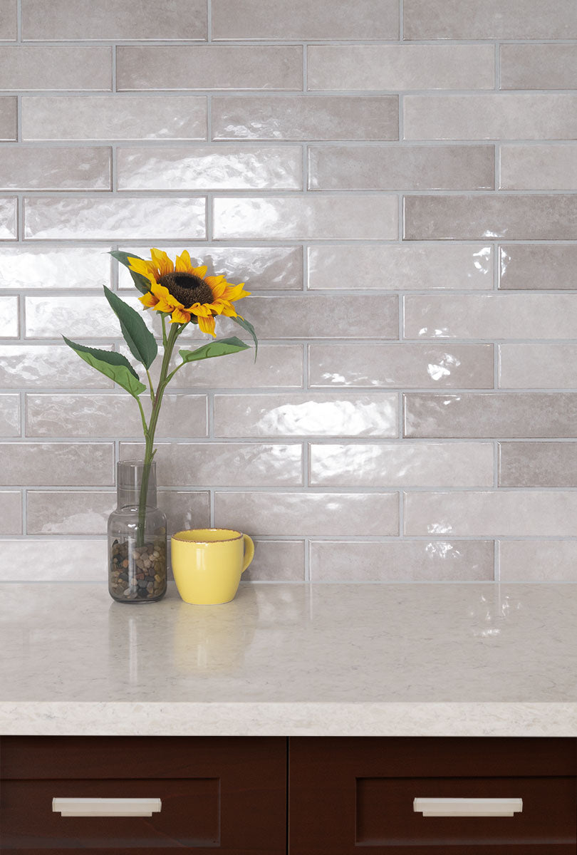 Renzo Glossy Ceramic Wall Tile — installed room view — color Sterling