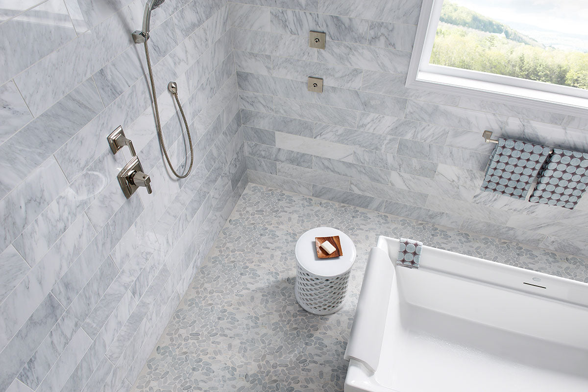 Rio Lago Natural-Stone Pebble Mosaic — installed room view — color Sliced Carrara White