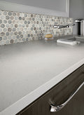 Stonella 2-inch Hexagon 6mm Recycled-Glass Mosaic — installed room view — color Stormy blue, greige and gray