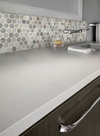 Stonella 2-inch Hexagon 6mm Recycled-Glass Mosaic — installed room view — color Stormy blue, greige and gray