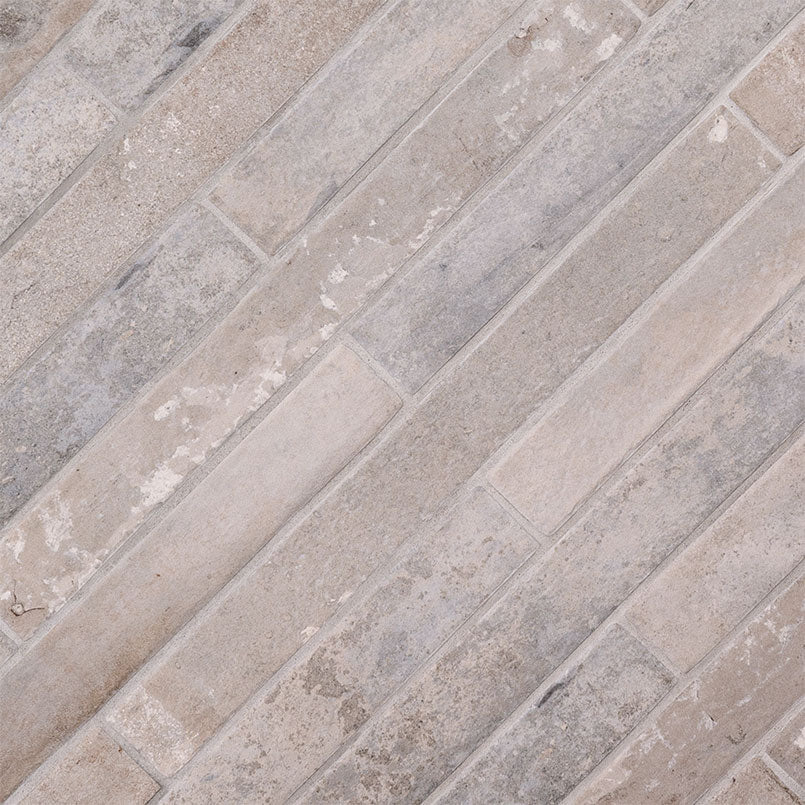 Brickstone Taupe 2x18 — angled surface view; illustration, not a measured scale reference (NCAPTAUBRI2X18)