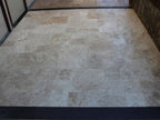 Tuscany Beige Honed-and-Filled Travertine Tile — installed room view — color Beige and ivory
