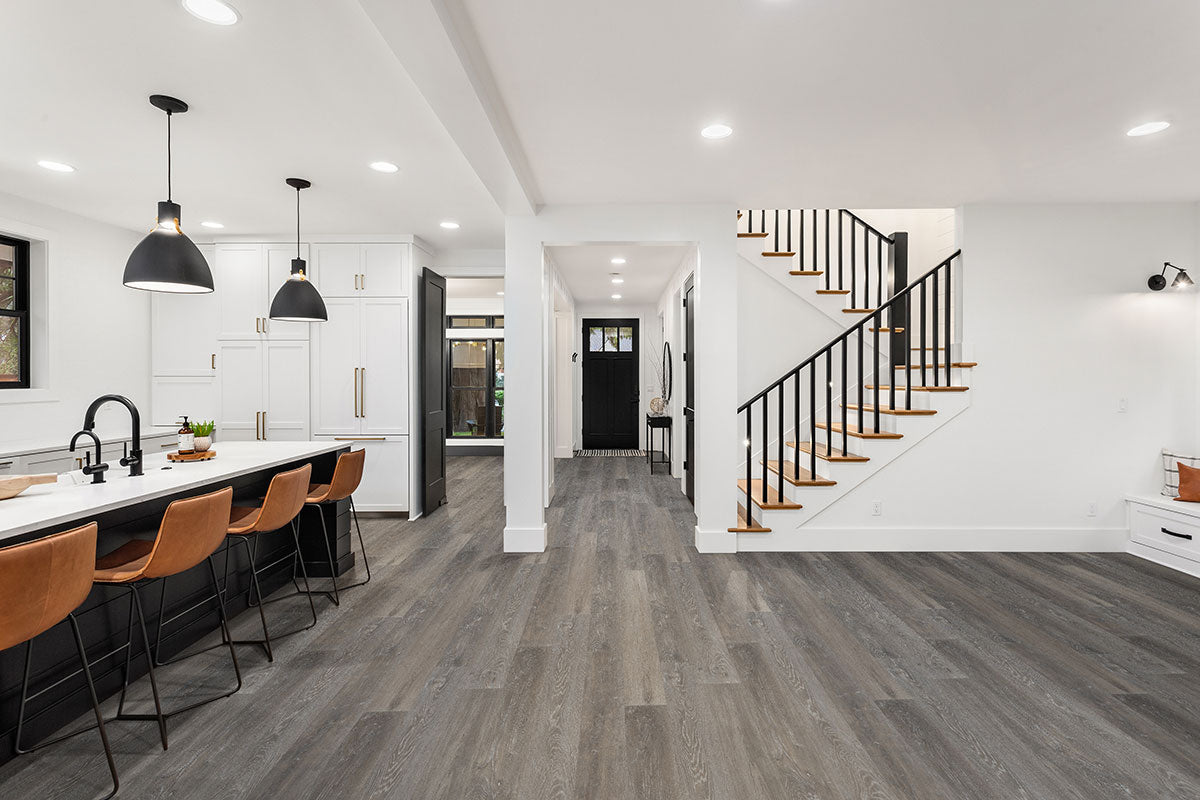 Wilmont 7x48 Glue-Down Luxury Vinyl Plank — installed room view — color Elmwood Ash